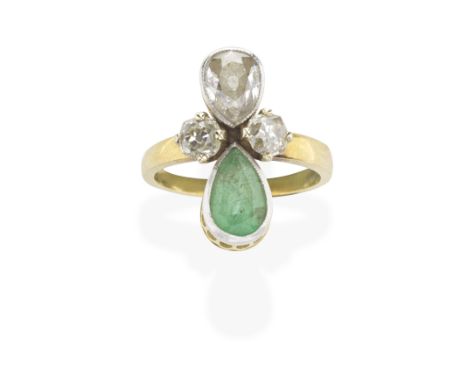 EMERALD AND DIAMOND RINGThe opposing pear-shaped emerald and pear-shaped diamond, between old brilliant-cut diamonds, diamond