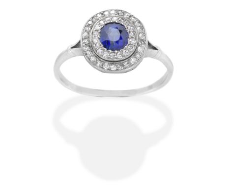 SAPPHIRE AND DIAMOND CLUSTER RING, EARLY 20TH CENTURYThe oval-cut sapphire with single-cut diamonds, sapphire approx. 0.60ct 