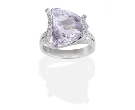 KUNZITE AND DIAMOND RING, 2005Triangular-cut kunzite and brilliant-cut diamonds, mounted in 18 carat white gold, London hallm