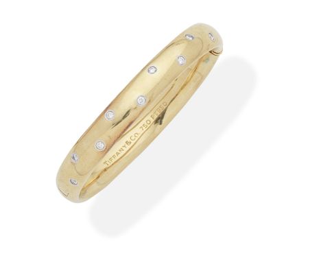 TIFFANY: DIAMOND-SET BANGLEThe hinged bangle, set to the front with brilliant-cut diamonds, diamonds approx. 0.50ct total, si