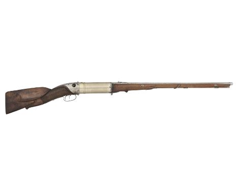 A RARE 16 BORE GERMAN AIRGUN BY CARL RUT, CARLSRUHE, DATED 1834 with octagonal sighted barrel sleeved in brass, rotating at t