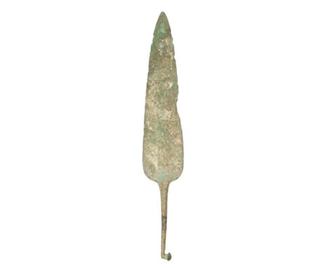 ‡ A LURISTAN COPPER ALLOY SPEARHEAD, 1300-900 B.C. in excavated condition, formed in one piece, with broad leaf-shaped blade 