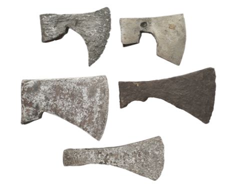 ‡ FOUR BEARDED AXES AND A FURTHER AXE, 9TH/13TH CENTURIES the first with curved blade and pronounced beard, struck with a mar