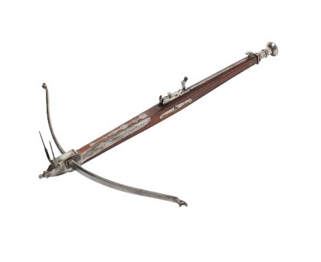 ‡ AN ENGLISH STONEBOW, MID-18TH CENTURY with slender steel bow (string missing) retained by a pair of irons terminating in a 
