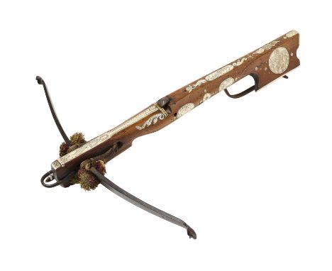 A GERMAN SPORTING CROSSBOW, CIRCA 1750 with slender steel bow (string missing), retained by early cords and multi-coloured po