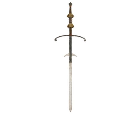 ‡ A FINE GERMAN TWO-HAND PROCESSIONAL SWORD, LATE 16TH CENTURY with long broad blade of flattened-hexagonal section widening 
