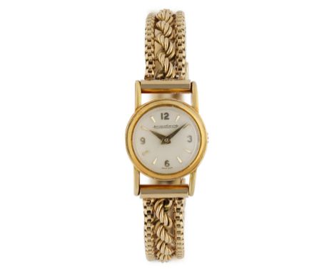 JAEGER LECOULTRE, Gelbgold 18K, Durchmesser 15,8 mm, Gehäuse Weisses Zifferblatt mit arabischen Zahlen bei 3, 6, 9 und 12 Uhr