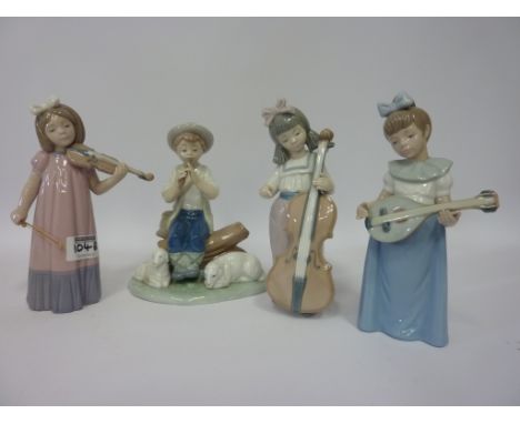 Four Nao figures - children playing instruments