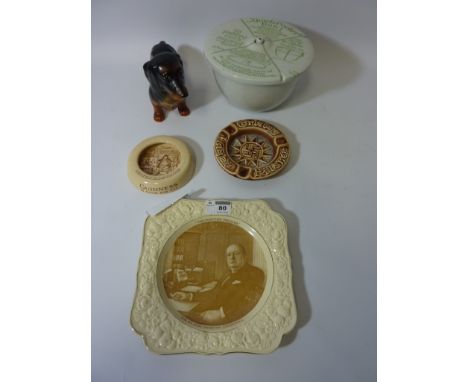 A mid 20th century Crown Ducal plate`The Fighting Premier` printed with a portrait of Winston Churchill, Guinness and Carlsbe