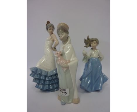 Lladro figure of a child with a toy and two Nao figures (3)