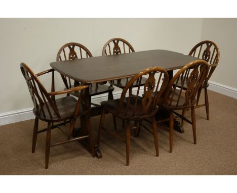 Ercol elm rectangular dining table (71cm x 139cm), and six matching stick and hoop back chairs Condition Report Click here fo