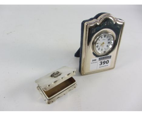 Silver commemorative snuff box and a freestanding mantle clock in silver frame both hallmarked