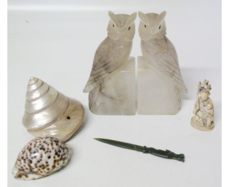 Two translucent marble owls, along with an ivory netsuke, jade letter opener and two shells Condition reports are not availab