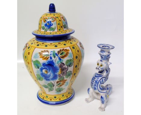 FaÃ¯ence lidded case and a dragon candlestick Condition reports are not available for this sale.