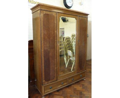 An Edwardian mirror-door, oak-cross, banded wardrobe Condition reports are not available for this sale.