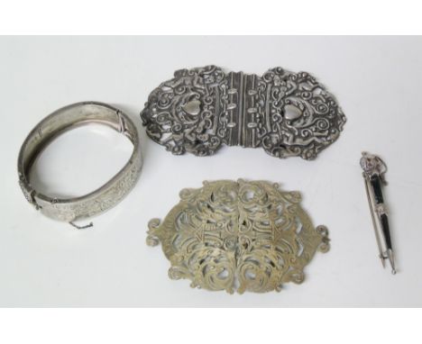 An EPNS nurses buckle and another white metal example, a silver bangle and a white metal pin brooch (Victorian) Condition rep