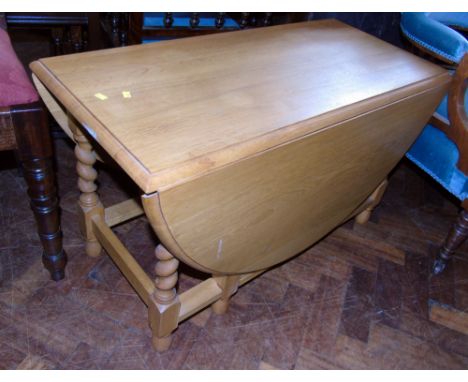 Early 20th century light oak miniature gate-leg barley-twist table, 85 x 113cm. Condition reports are not available for this 