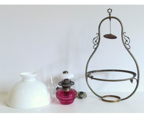 A Victorian ruby glass hanging lamp with shades and an embossed table lamp Condition reports are not available for this sale.