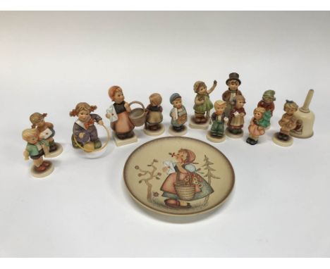 Thirteen Hummel figures, a bell, plates etc