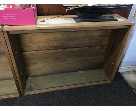 A light oak three door display cabinet, with glass shelves, 154cm x 106cm x 40cm