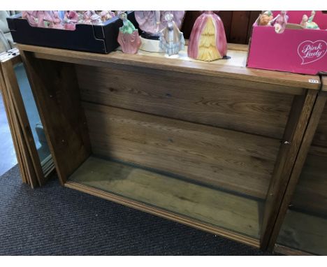A light oak three door display cabinet, with glass shelves, 154cm x 106cm x 40cm