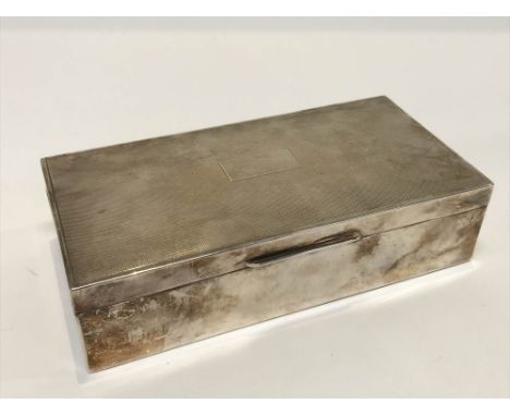 An engine turned Birmingham silver cigarette box