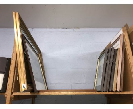 Shelf of pictures and a mirror