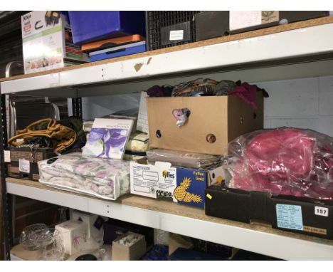Shelf of handbags, as new bedding and hats