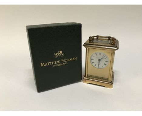 A boxed Matthew Norman carriage clock