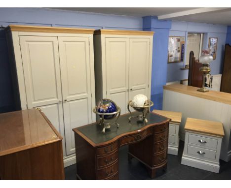 A light grey bedroom suite, comprising wardrobes, a pair of bedside chests and a large chest of drawers (as new)
