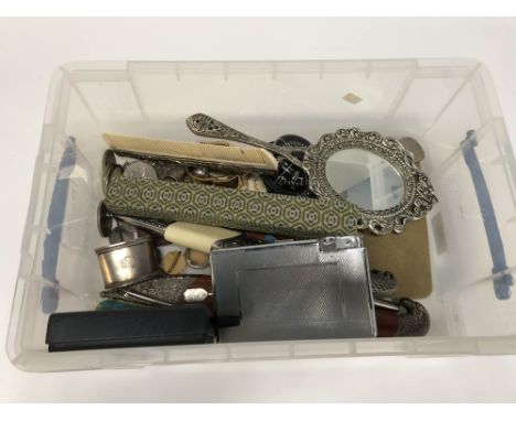 A box containing coins, mirrors, compass etc