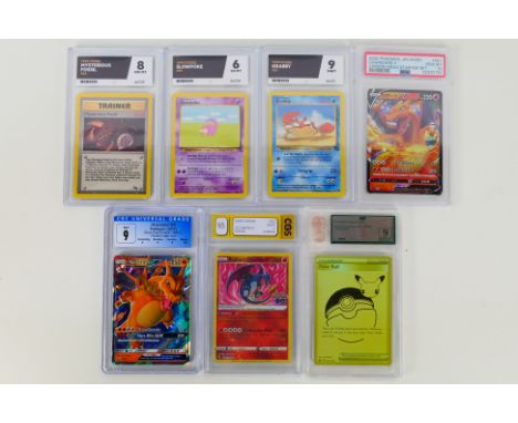 Pokemon - Seven cards to include: Black Star Promos Hidden Fates Charizard GX SM211 - 2019 graded Mint 9 overall, (centering 