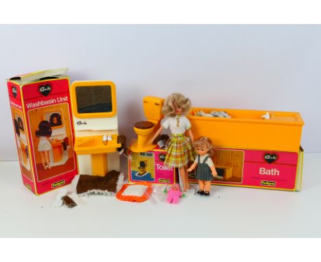 Sindy - Vintage Sindy and three boxed items. Sindy wears a two piece outfit and comes with white shoes and a stand. Fingers a