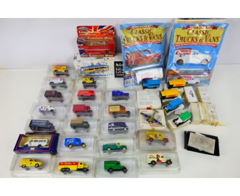 Lledo - Corgi - Welly - A collection of over 20 mostly boxed diecast model vehicles in various scales predominately from the 