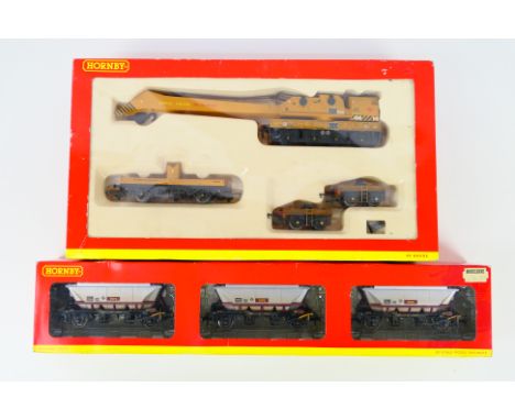 Hornby - 2 x boxed OO gauge wagon sets, a 75 Ton Breakdown Crane ADB 141 in weathered finish # R6204 and a set of 3 x EWS Chi