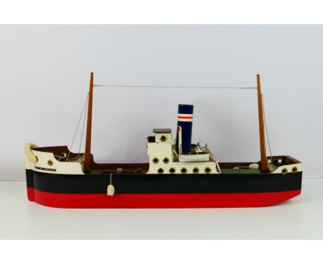 Tri-ang - A wooden model of a Coastal steamer named 'British Merchant'. The model attributed to Tri-ang measures approximatel