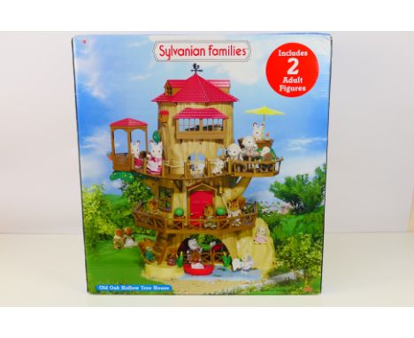 Sylvanian Families - A boxed Sylvanian Families Old Oak Hollow Tree House set. The item appears in Excellent condition with u