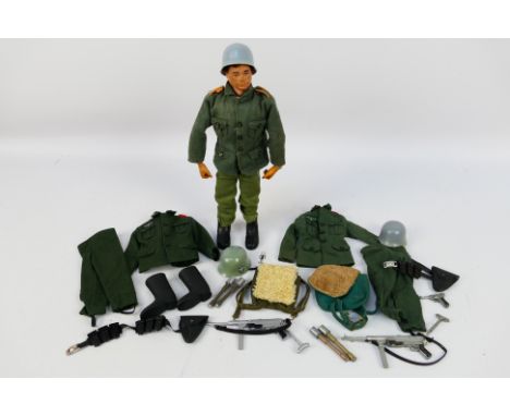 Action Man - Palitoy - An unboxed vintage Action Man with loose incomplete German Stormtrooper uniforms. The dark brown flock