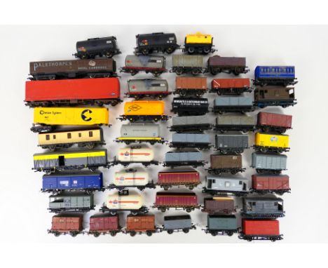 Hornby - Bachmann - A collection of unboxed OO gauge rolling stock, including open wagons, tank wagons and guards vans. They 