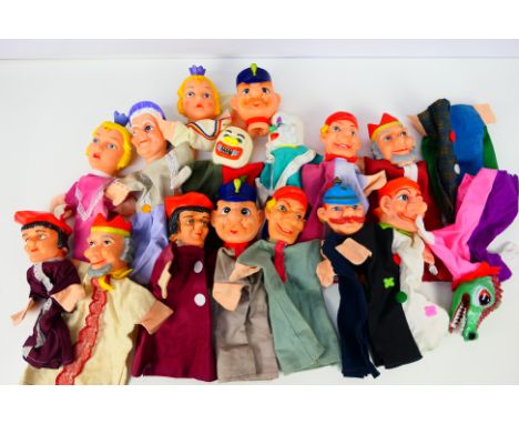 A group of 15 vintage vinyl finger 'Punch & Judy' style finger puppets. Puppets depict various characters such as Punch, Gran