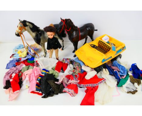 Pedigree - Sindy - A collection of vintage Sindy items including a Sindy doll, 2 x horses, a Car and a quantity of clothing. 