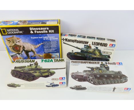 Tamiya model kits - Four boxed model kits to include 3 x Tamiya 1/35 scale tanks and 1 x National Geographic Dinosaur fossil 