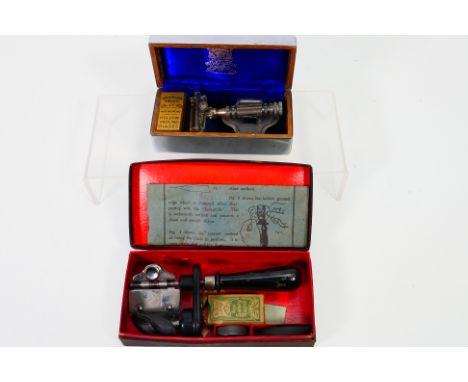 A boxed Wilkinson Sword safety razor and a Tarantella razor sharpener, also boxed. [W]