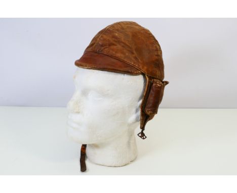 A World War One (WW1 / WWI) period Royal Flying Corps (RFC) type leather flying helmet, brown leather with chin strap and thr