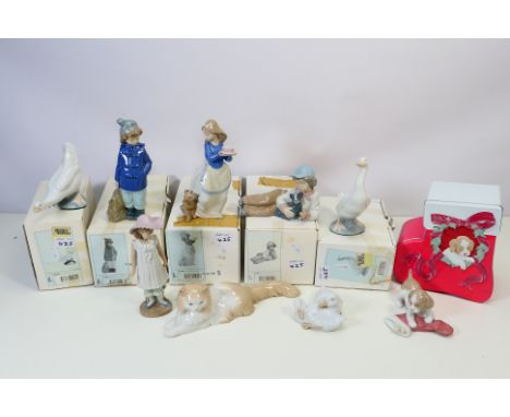 Nao by Lladro - nine figurines comprising model numbers 00244, 00245, 01045, 1149, 01036, and 02007427, all boxed and three f