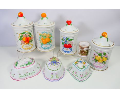 A collection of Franklin Mint Le Cordon Bleu porcelain to include four kitchen storage jars and lids and three jelly moulds. 