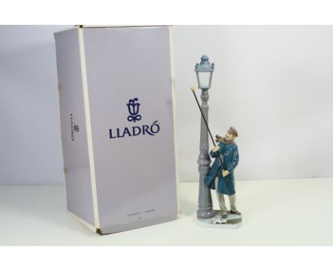 Lladro - a large figurine entitled 'Lamp Lighter', model number 05205, approx 47 cm (high), official Lladro backstamp to conf