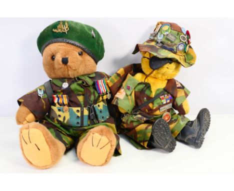 Two bears dressed in military uniform, one decorated with a set of World War One (WW1 / WWI) miniature medal trio and a World