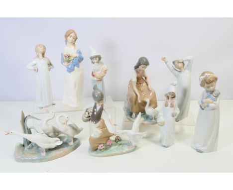 A collection of Lladro, Nao and similar figures / groups, largest approximately 24 cm (h). [W]NOTE: IN HOUSE SHIPPING IS NOT 