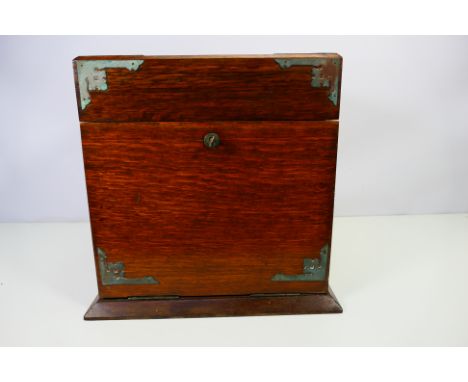 An oak box with hinged top opening to reveal a mirrored interior, the fall front with single drawer, houses cribbage board, a